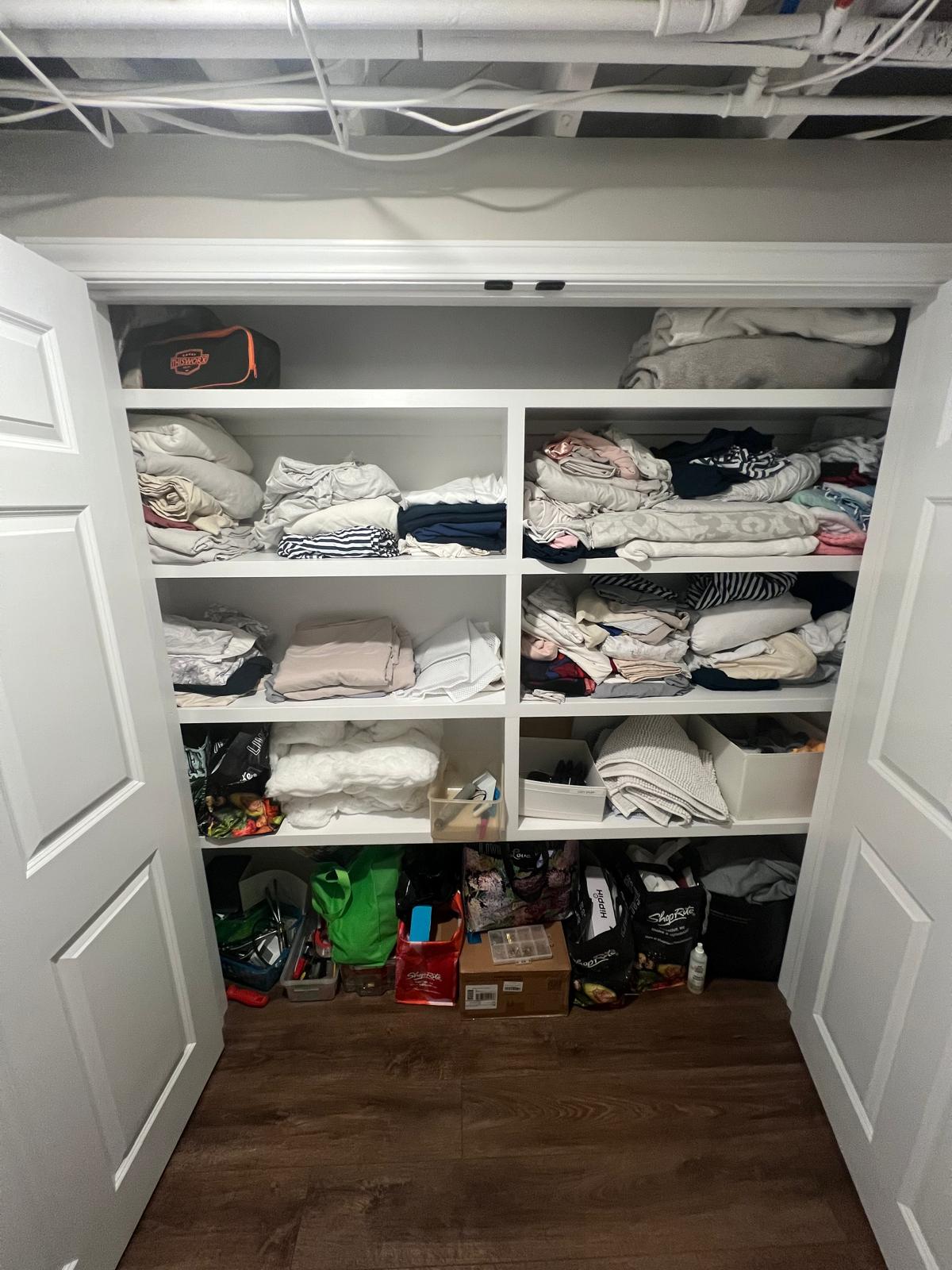 Linen closet before organizing