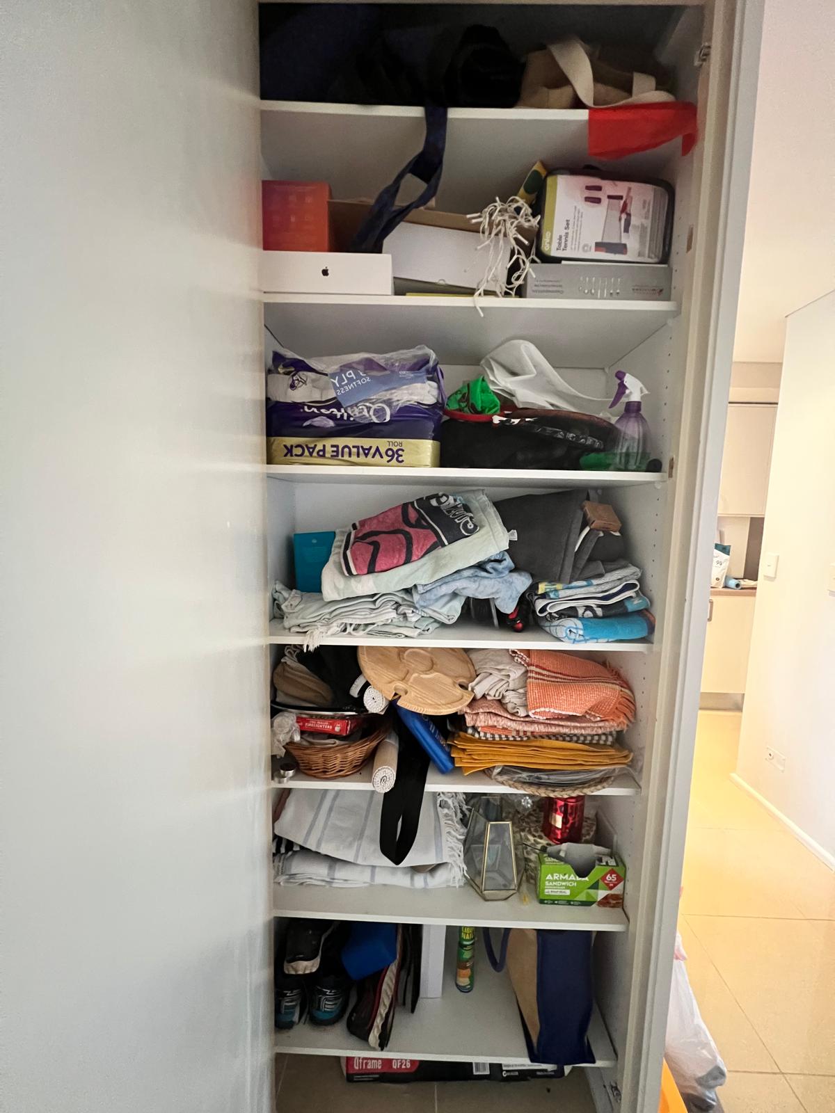 Storage closet before organizing
